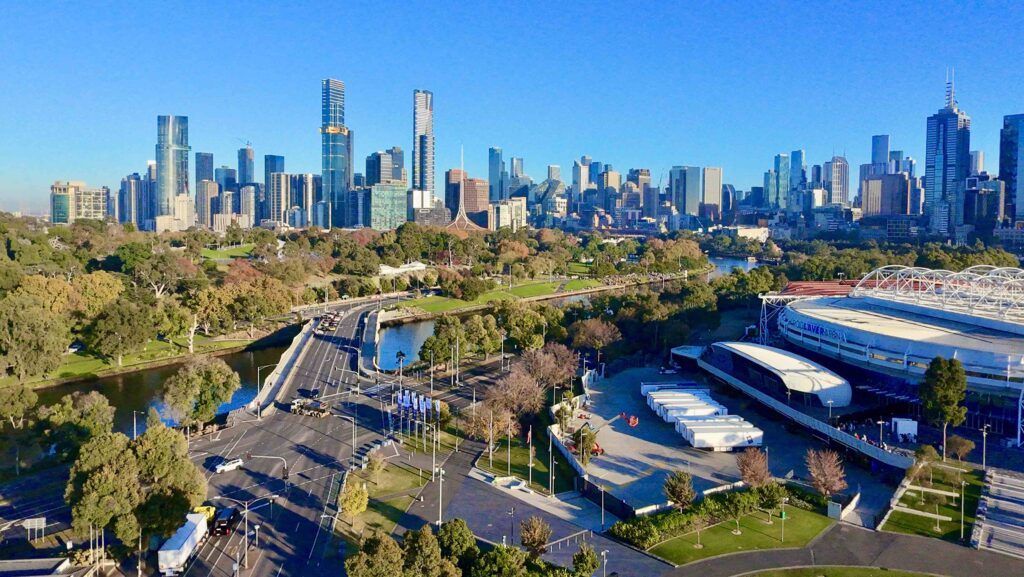 A panoramic view of the Melbourne sports precinct, showing Rod Laver Arena and the surrounding parklands connected by stone pathways supplied by Eigen Stones.