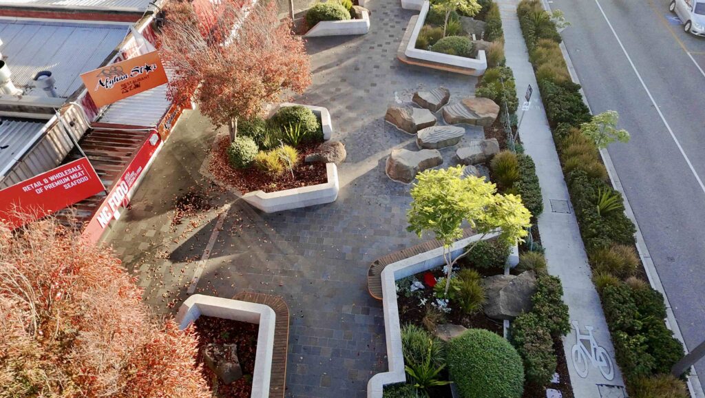 A close-up of the central polished stone pillar at the Glencoe Memorial, featuring the main commemorative plaque, with all stone supplied by Eigen Stones.