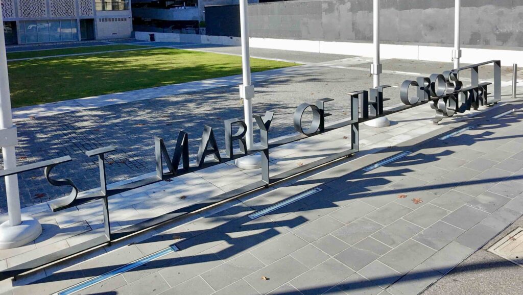 A patterned stone laneway supplied by Eigen Stones runs alongside the heritage brick and stone of the Victorian Women's Centre.