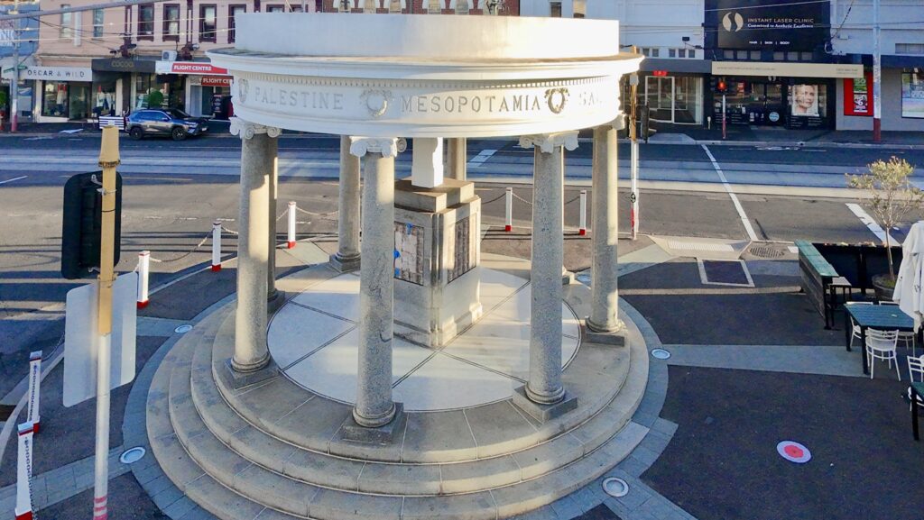 An aerial view of the iconic, circular Kew Memorial with its classical columns, showing the tiered stone base and paved floor supplied by Eigen Stones.