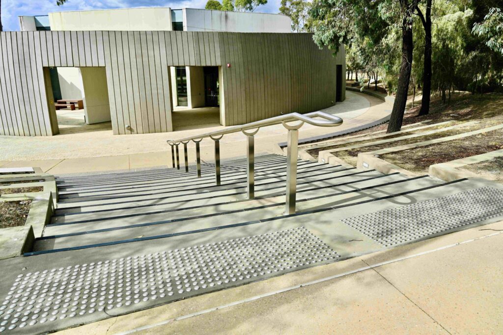  The futuristic, bio-mimetic architecture of a Monash University building, grounded by a unique hexagonal stone paver courtyard supplied by Eigen Stones.