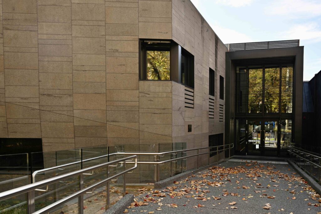 The modern, stone-clad facade of a building at St Kevin's, with an accessible ramp leading to the entrance, all featuring materials from Eigen Stones.