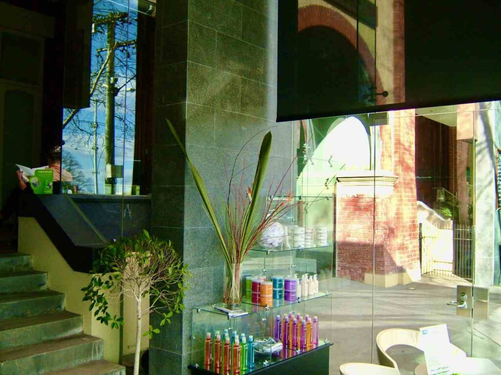 The sophisticated interior of 571 Fitzroy Street, showing how the dark stone wall cladding and floors from Eigen Stones complement the modern decor.
