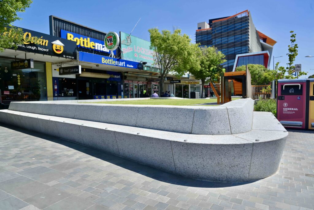 A close-up of the central polished stone pillar at the Glencoe Memorial, featuring the main commemorative plaque, with all stone supplied by Eigen Stones.